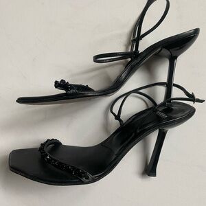 Cascadei black leather strap heels exclusive  of decoration . Sz 9B worn once.